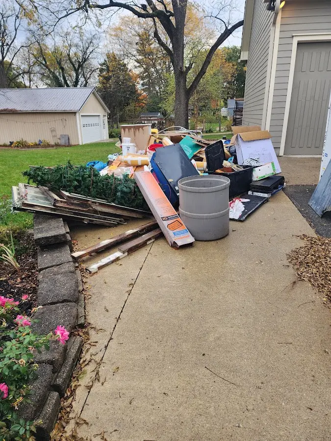 Dumpster being loaded with debris for Residential Dumpster Rental in Venice